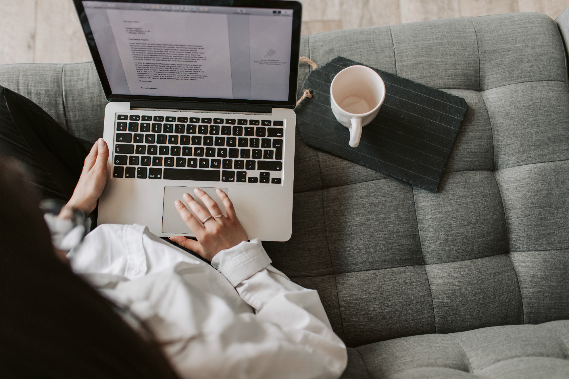 crop-woman-using-laptop-on-sofa-at-home-4050304.jpg
